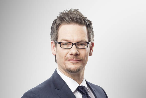 Ein sympathisches Portraitfoto von Marc Bäcker